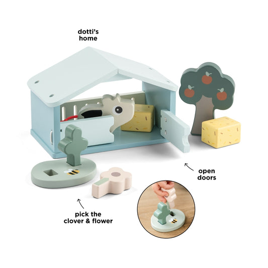 Copil care se joaca cu setul Tiny Farm Dotti Done by Deer