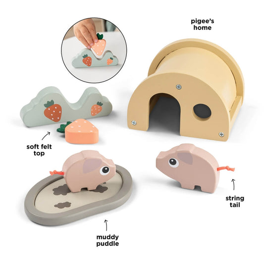Copil care se joaca cu setul Tiny Farm Pigee Done by Deer