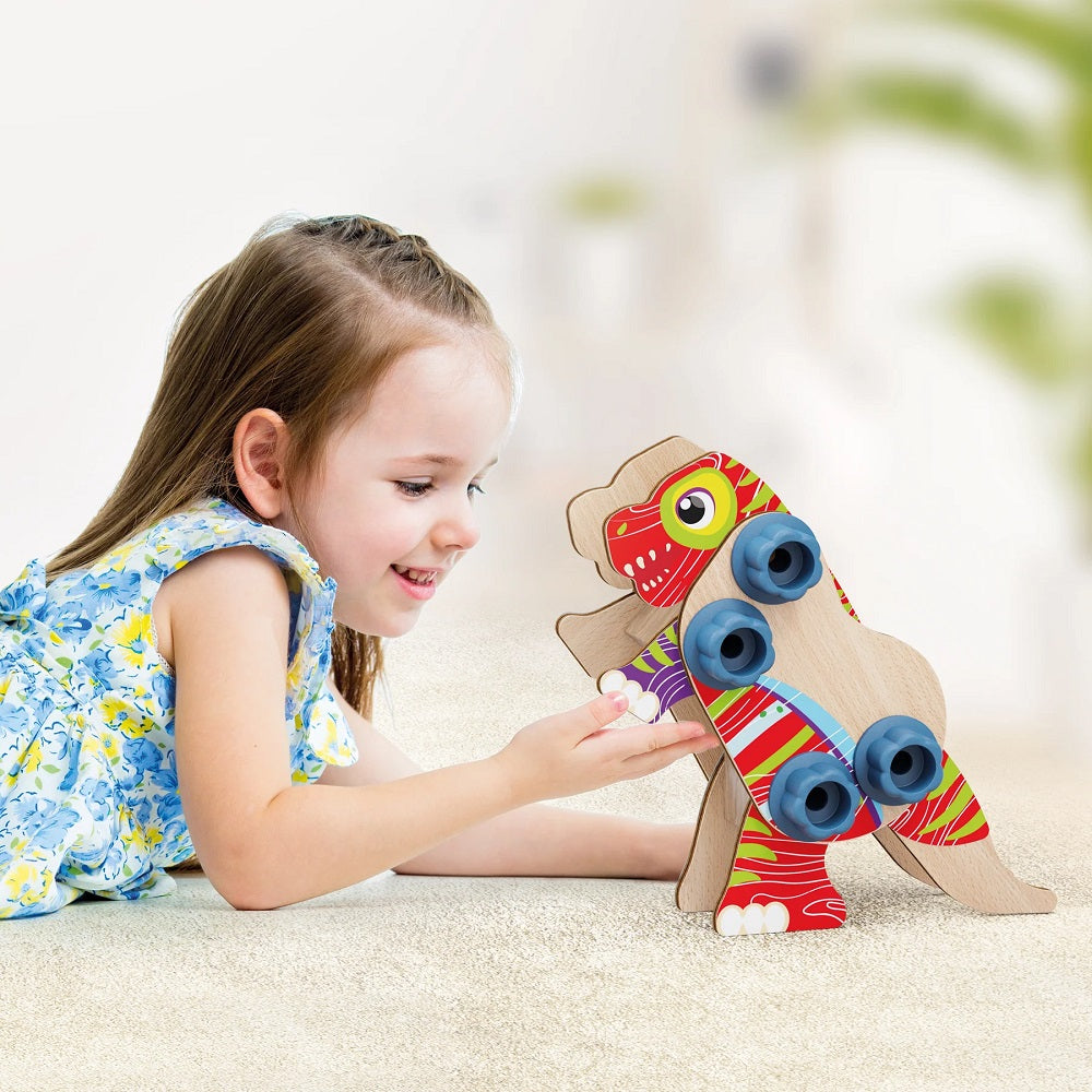 Set constructie dinozauri Quercetti Bio – copil care ține un dinozaur construit