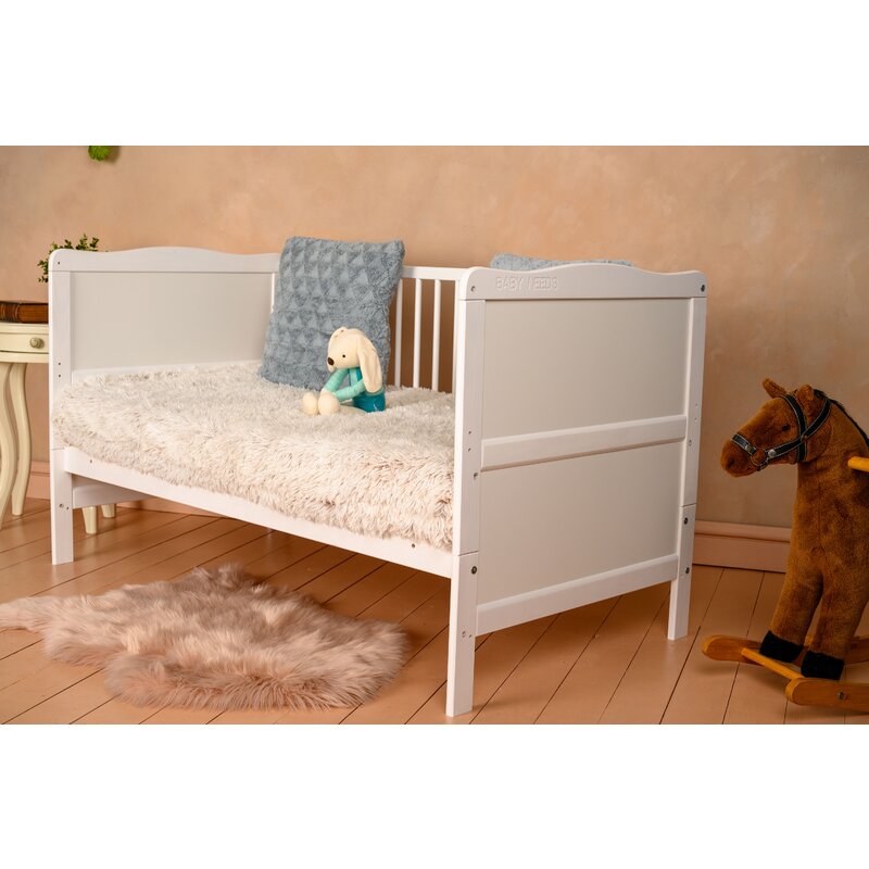 Patut din lemn bebe, Transformabil si pentru junior, 140x70 cm, Din lemn de pin si mdf, Stabil si rezistent, Inaltime saltea reglabila pe 3 nivele, Laterala cu 3 bete detasabile, EN716-1, EN716-2, Alb, Babyneeds, Nadia + Saltea 12 cm