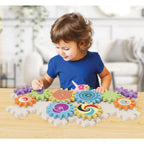 Set roti dintate Quercetti Kaleido Gears Eco – copil care explorează roțile dințate