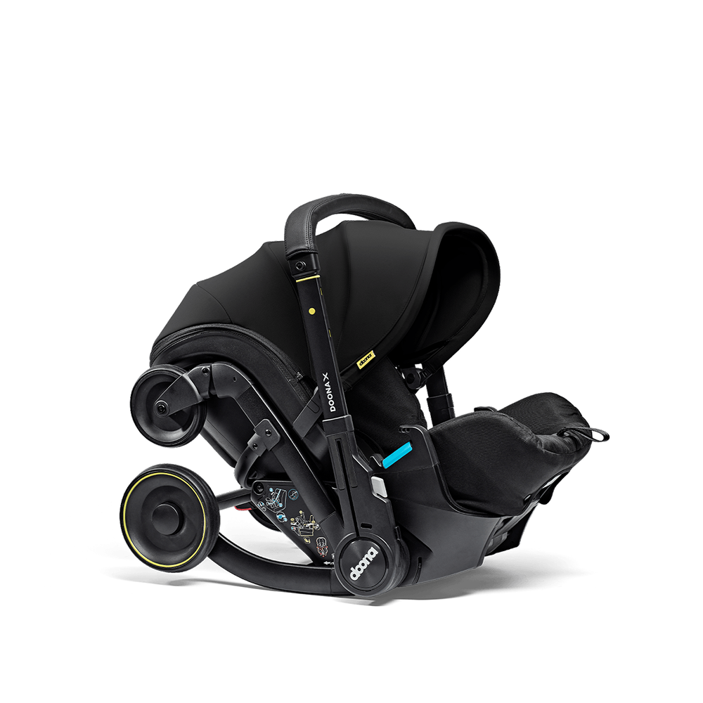 Scoică Auto Cărucior Doona X i-Size Nitro Black 2 în 1 - Transformare Rapidă